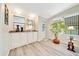 Home bar with a granite countertop and ample cabinet space at 926 Saint Andrews Blvd, Lady Lake, FL 32159