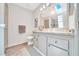 Neutral bathroom featuring a skylight, a shower behind glass doors, and a large countertop at 926 Saint Andrews Blvd, Lady Lake, FL 32159
