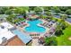 Lush tropical landscaping and multiple seating options accent this resort-style pool with cabanas and rock waterfall feature at 926 Saint Andrews Blvd, Lady Lake, FL 32159