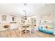 Bright dining room featuring wood floors, stylish furnishings, and decorative accents, creating an inviting atmosphere at 926 Saint Andrews Blvd, Lady Lake, FL 32159