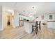 Open kitchen area with central island, modern appliances, and stylish decor, creating a welcoming space for gatherings at 926 Saint Andrews Blvd, Lady Lake, FL 32159