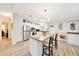Spacious kitchen features modern appliances, an island with seating, and plentiful storage, ideal for cooking and entertaining at 926 Saint Andrews Blvd, Lady Lake, FL 32159