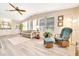 Comfortable sunroom with ample natural light and stylish decor at 926 Saint Andrews Blvd, Lady Lake, FL 32159