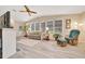 Sunroom with comfortable seating and scenic views at 926 Saint Andrews Blvd, Lady Lake, FL 32159