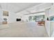 Spacious living room with an open floor plan and access to a patio, ideal for comfortable living at 926 Saint Andrews Blvd, Lady Lake, FL 32159