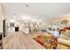 Open floor plan with a modern kitchen and a spacious living area at 926 Saint Andrews Blvd, Lady Lake, FL 32159