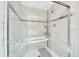 A close-up of the pristine shower with tiled walls and a sleek glass door at 926 Saint Andrews Blvd, Lady Lake, FL 32159