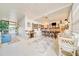 The sunroom offers an indoor bar with barstool seating and a round table, ideal for entertaining at 926 Saint Andrews Blvd, Lady Lake, FL 32159