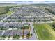A high angle view showcasing the property's location in a neighborhood near a nature preserve with lake at 9380 La Salle St, Groveland, FL 34736