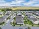 Aerial view of a neighborhood filled with single-Gathering homes, close to highway, surrounded by lush green wetlands at 9380 La Salle St, Groveland, FL 34736