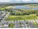 Real estate offering proximity to lake, green spaces, tree lined streets, a beautiful lake and the benefits of suburban living and recreation at 9380 La Salle St, Groveland, FL 34736