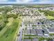 Residential homes with manicured lawns and tree-lined streets close to green spaces, offering suburban living with a blend of nature and community at 9380 La Salle St, Groveland, FL 34736