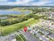 Overhead view of a lovely home with a serene lake and nature preserve in the background at 9380 La Salle St, Groveland, FL 34736