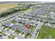 High angle of the property within a community close to a green space, highlighting neighborhood layout at 9380 La Salle St, Groveland, FL 34736