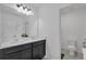 Bathroom featuring a dual sink vanity with white countertop and fixtures at 9380 La Salle St, Groveland, FL 34736