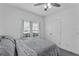 Bright bedroom with a ceiling fan and a view from the window at 9380 La Salle St, Groveland, FL 34736