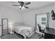 Comfortable bedroom setup with a desk, chair and TV at 9380 La Salle St, Groveland, FL 34736