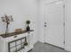 Bright entryway featuring a white door, console table, and neutral decor at 9380 La Salle St, Groveland, FL 34736