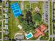 Aerial view of the community's amenities: tennis courts, a pool, and a recreation center at 9790 Se 175Th St, Summerfield, FL 34491