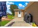 Back door of home featuring covered grill and patio area perfect for outdoor cooking and entertaining at 9790 Se 175Th St, Summerfield, FL 34491