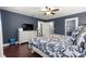 Comfortable bedroom features an entertainment center with TV, providing relaxation and enjoyment at 9790 Se 175Th St, Summerfield, FL 34491