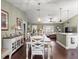 Open concept dining area with access to living room and kitchen with plentiful natural light at 9790 Se 175Th St, Summerfield, FL 34491