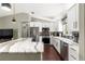 Modern kitchen with a large island featuring a stone countertop and sleek stainless steel appliances at 9790 Se 175Th St, Summerfield, FL 34491