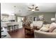 Open-concept living room showcasing the kitchen with island seating and dining area, perfect for entertaining at 9790 Se 175Th St, Summerfield, FL 34491