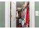 View of a packed walk-in closet with lots of storage at 9790 Se 175Th St, Summerfield, FL 34491
