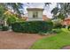Landscaped backyard with lush greenery, providing privacy and a serene outdoor space at 1055 Avenida Sonoma, Lady Lake, FL 32159