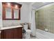 Bathroom with tiled shower and tub combination, vanity, and commode at 1055 Avenida Sonoma, Lady Lake, FL 32159
