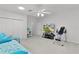 Large bonus bedroom featuring an exercise machine, television, closet and storage at 1055 Avenida Sonoma, Lady Lake, FL 32159