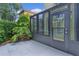 Enclosed patio with a glass enclosure, offering a versatile space for relaxation and entertaining at 1055 Avenida Sonoma, Lady Lake, FL 32159