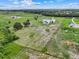 Expansive land with a new farmhouse offers serene country living and ample space at 10711 County Road 561, Clermont, FL 34711