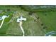 Aerial view of the home showing the surrounding area and large pasture at 10711 County Road 561, Clermont, FL 34711