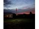 Backyard view features American flag with a starlit sky at sunset for patriotism at 10711 County Road 561, Clermont, FL 34711