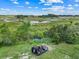 Aerial of the backyard wetland area with an airboat and place to launch it at 10711 County Road 561, Clermont, FL 34711