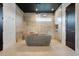 Modern bathroom featuring dual shower heads, and a contemporary soaking tub at 10711 County Road 561, Clermont, FL 34711