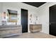 Modern bathroom with dual vanities, unique lighting, and contemporary design elements at 10711 County Road 561, Clermont, FL 34711