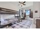 Cozy bedroom featuring a bunk bed, window views, and plenty of natural light at 10711 County Road 561, Clermont, FL 34711