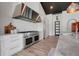 Stylish kitchen featuring stainless steel appliances, a brick backsplash, and ample counter space at 10711 County Road 561, Clermont, FL 34711
