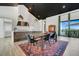 Bright kitchen features a large island, stainless steel appliances, and an open dining area with scenic views at 10711 County Road 561, Clermont, FL 34711