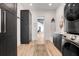 Laundry room with dark cabinets and new stacked washer dryer at 10711 County Road 561, Clermont, FL 34711