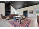 Open-concept living space with a dining table, living room, fireplace and wood-look floors at 10711 County Road 561, Clermont, FL 34711