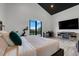 Comfortable main bedroom includes a king-size bed, sitting area, TV and views to the outside at 10711 County Road 561, Clermont, FL 34711