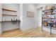 Spacious walk-in pantry with open shelving, ample storage, and convenient sink area at 10711 County Road 561, Clermont, FL 34711