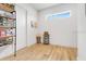 Pantry with wood floors, open shelving filled with cans and other supplies at 10711 County Road 561, Clermont, FL 34711