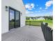 View from the patio showing a grassy area and neighborhood homes at 10711 County Road 561, Clermont, FL 34711