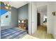 Play room with geometric rug, large window, and lots of toys at 10711 County Road 561, Clermont, FL 34711