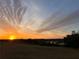 Breathtaking sunset view with colorful clouds, trees, and tranquil landscape at 10711 County Road 561, Clermont, FL 34711